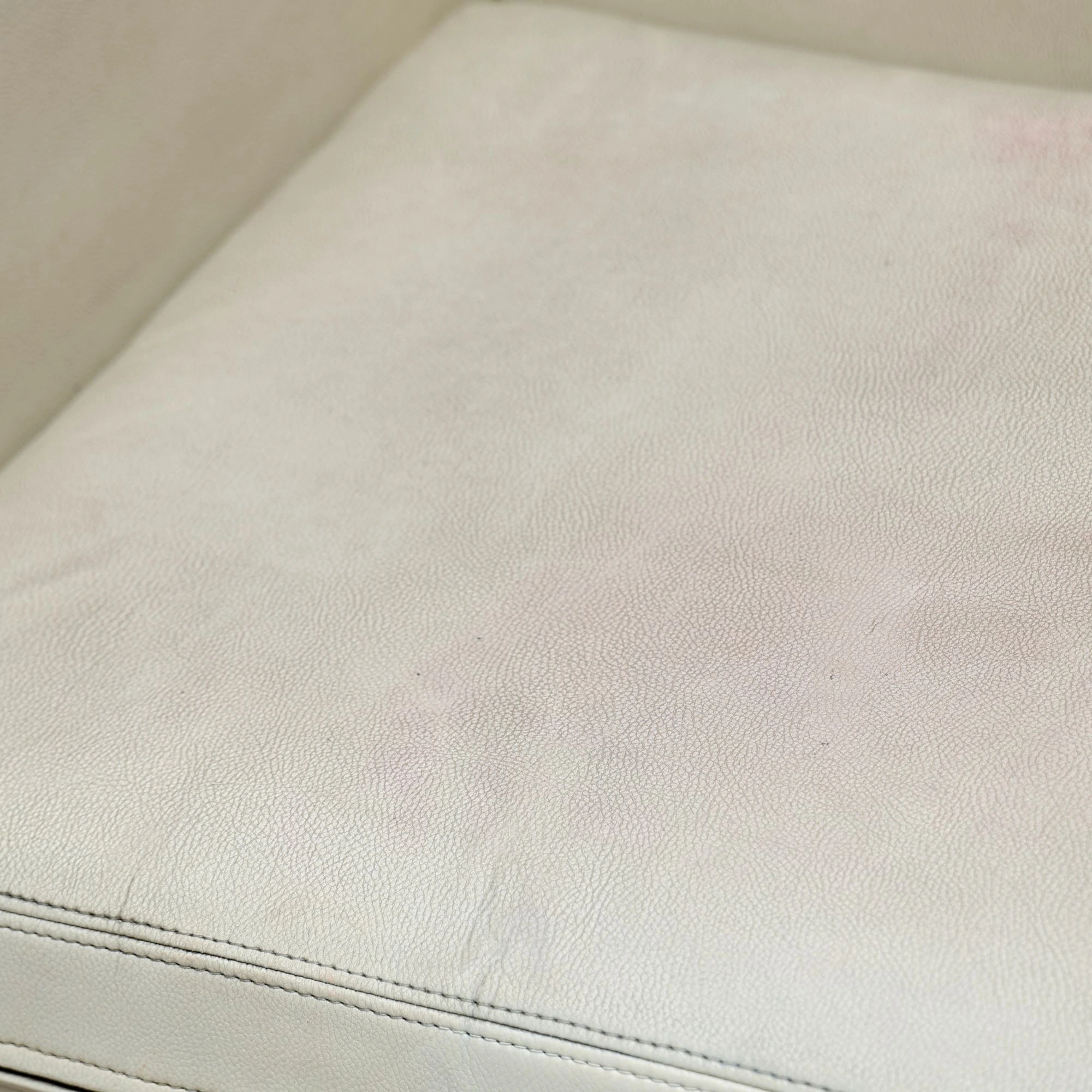 Old leather sofa before restoration — worn out and faded