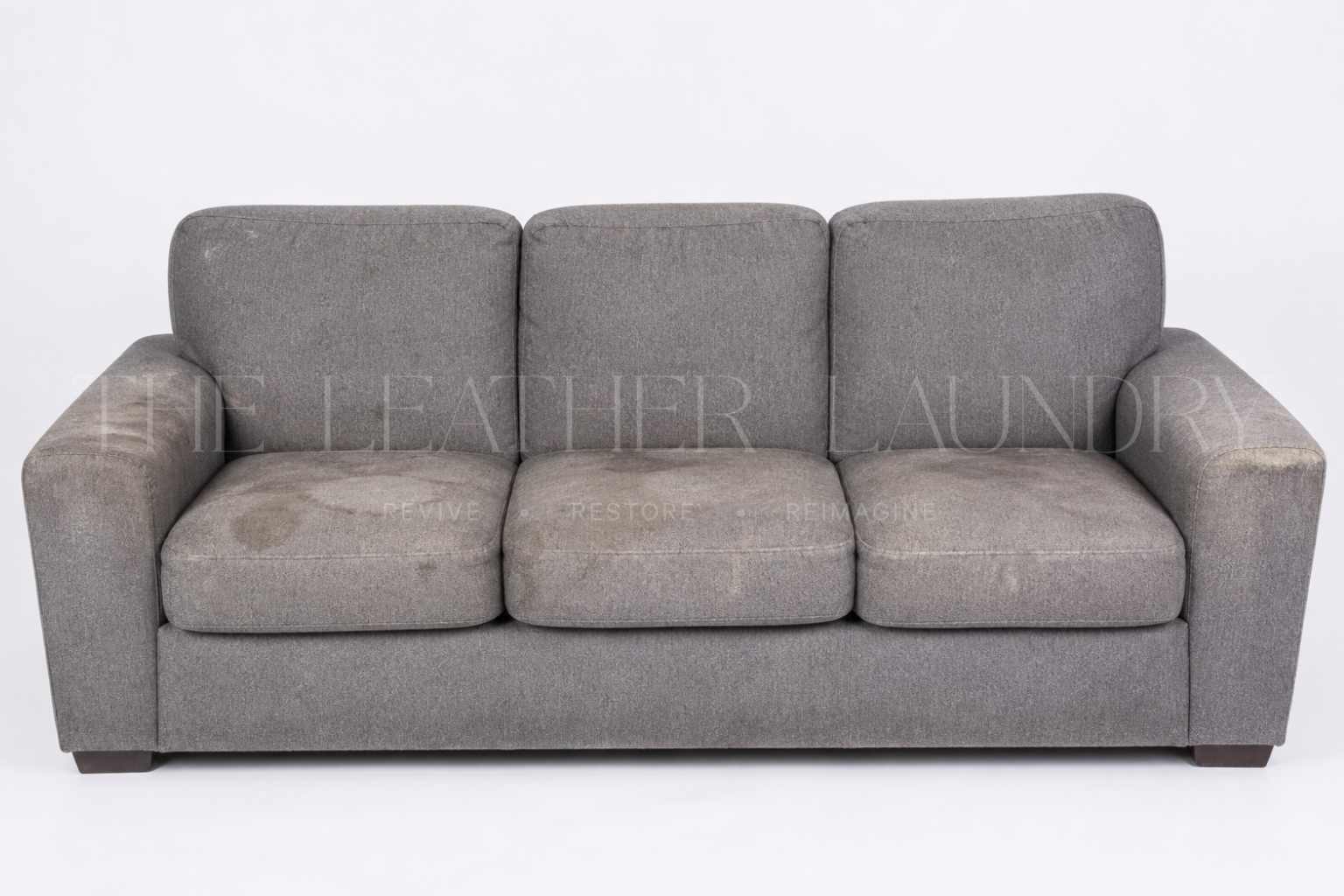 Leather sofa before reupholstery — worn colour and surface