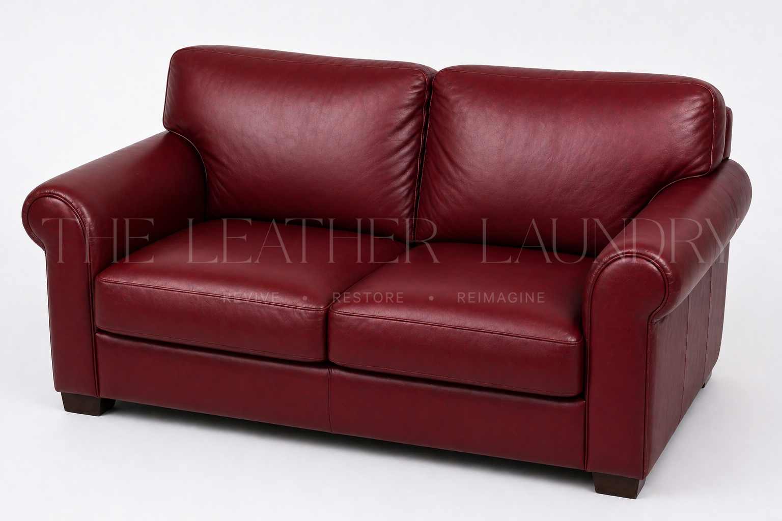 Faded leather sofa after professional colour restoration — The Leather Laundry