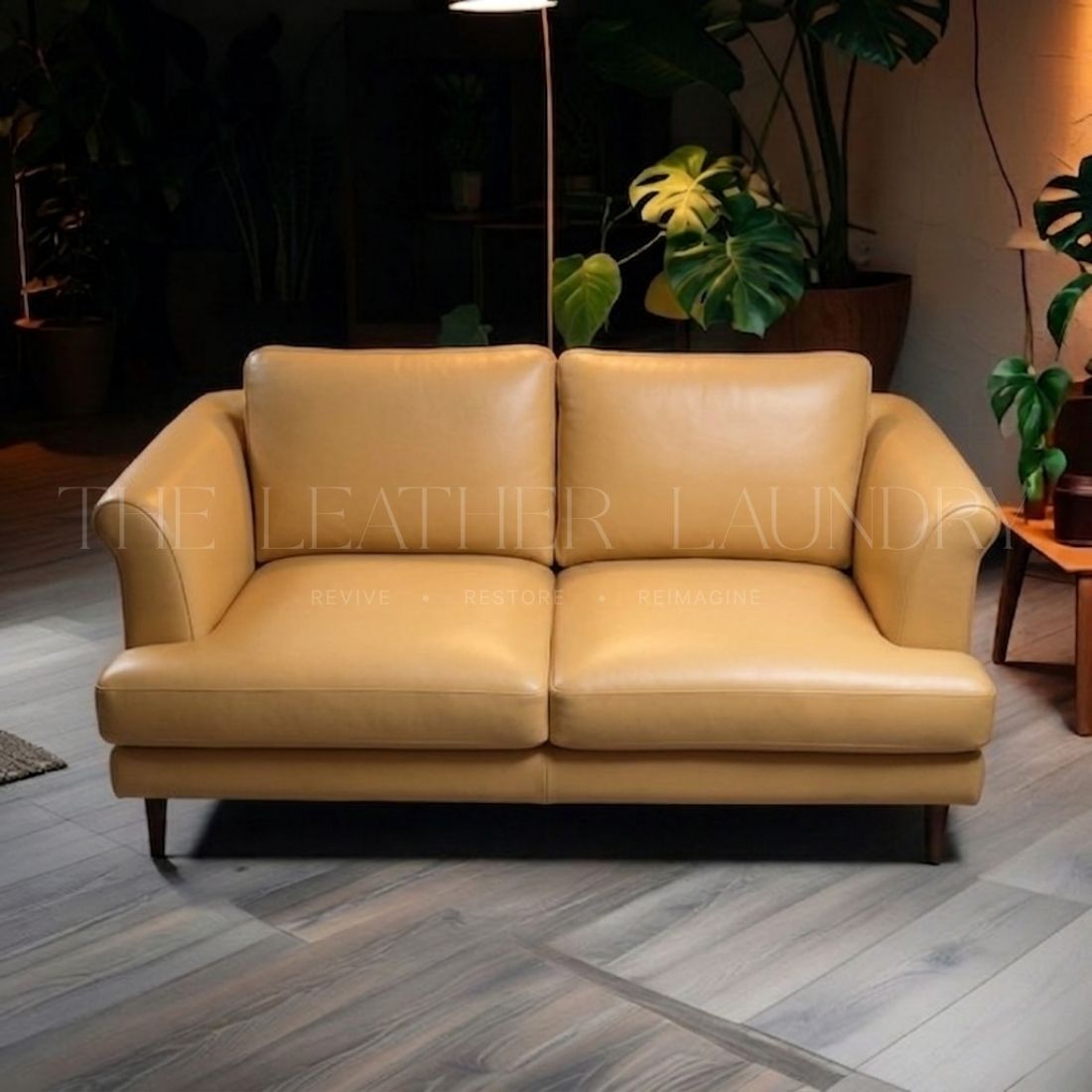 Leather sofa before colour touch up — worn and faded finish